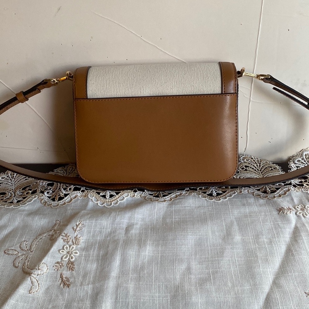 Beautiful Michael Kors  leather & canvas. 9” W 6 -1/2 .